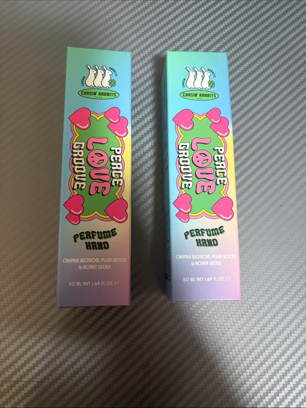 Peace Love Groove Perfume Hand Moisturizer — Pink lotion blends clear (2 pieces)